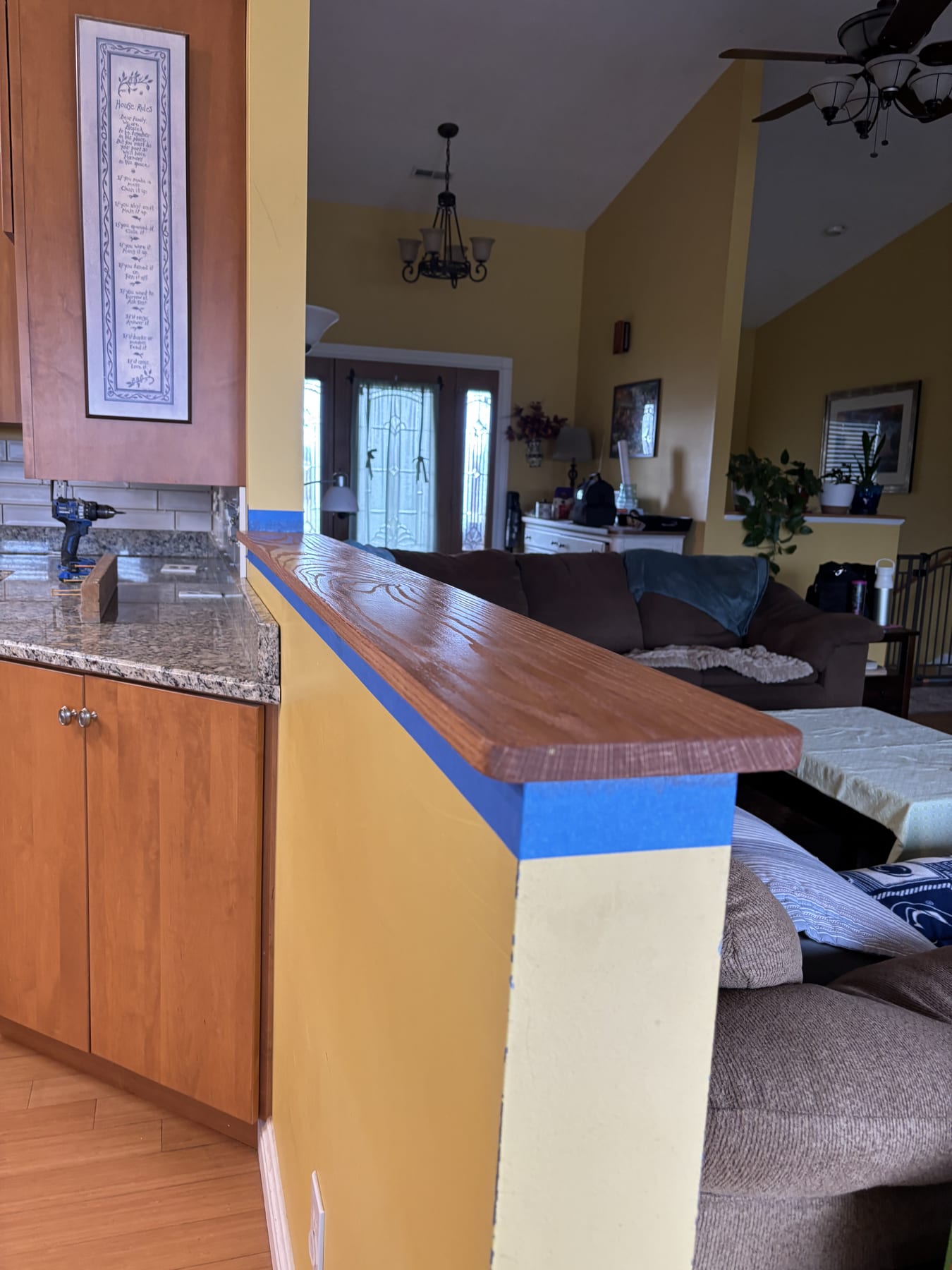 Bright yellow kitchen remodel with custom cabinetry and finish work.