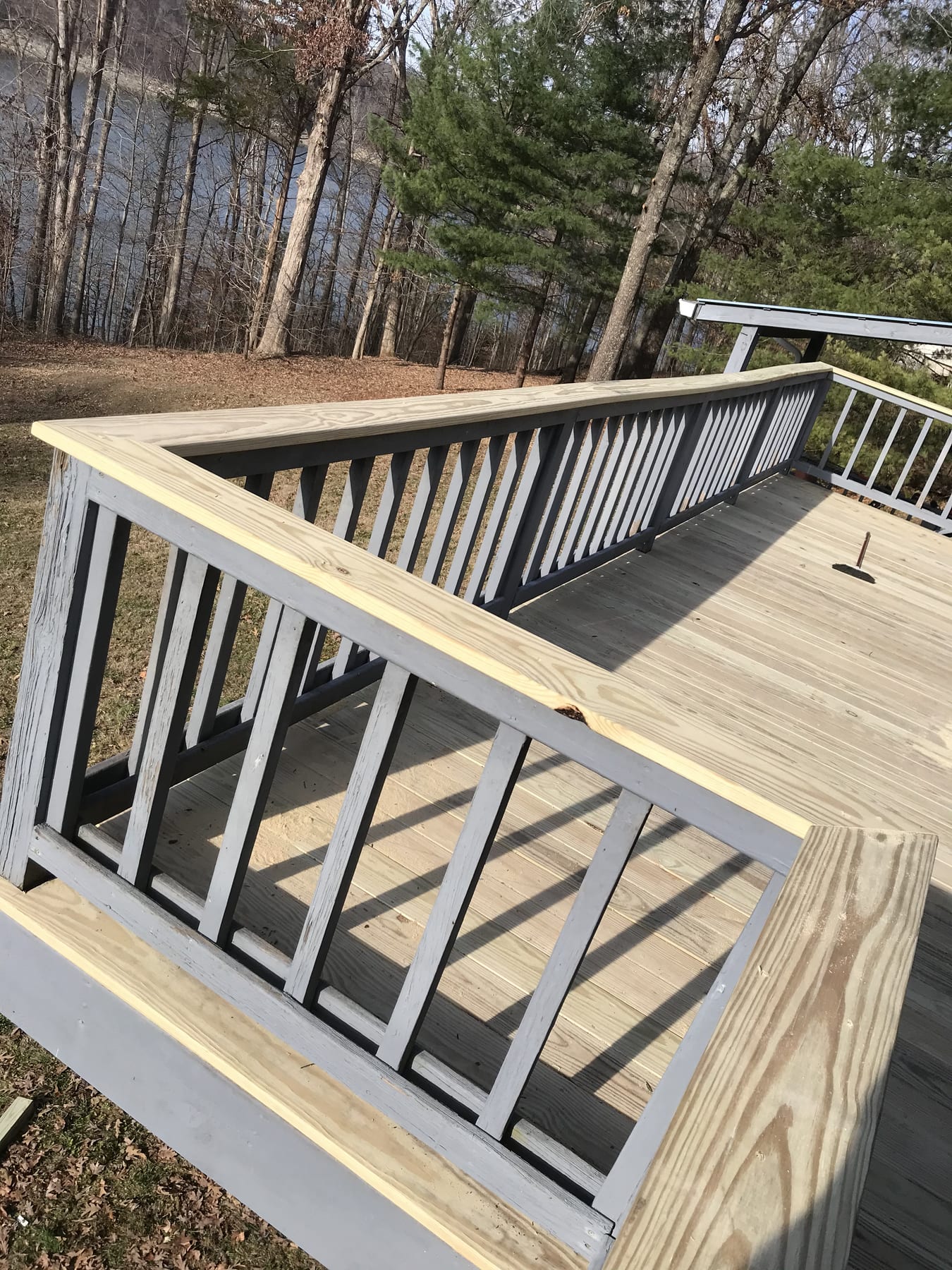 Custom cedar deck · Somerset, KY Custom cedar deck with railings on a Somerset KY home, built by Rust & Sawdust.