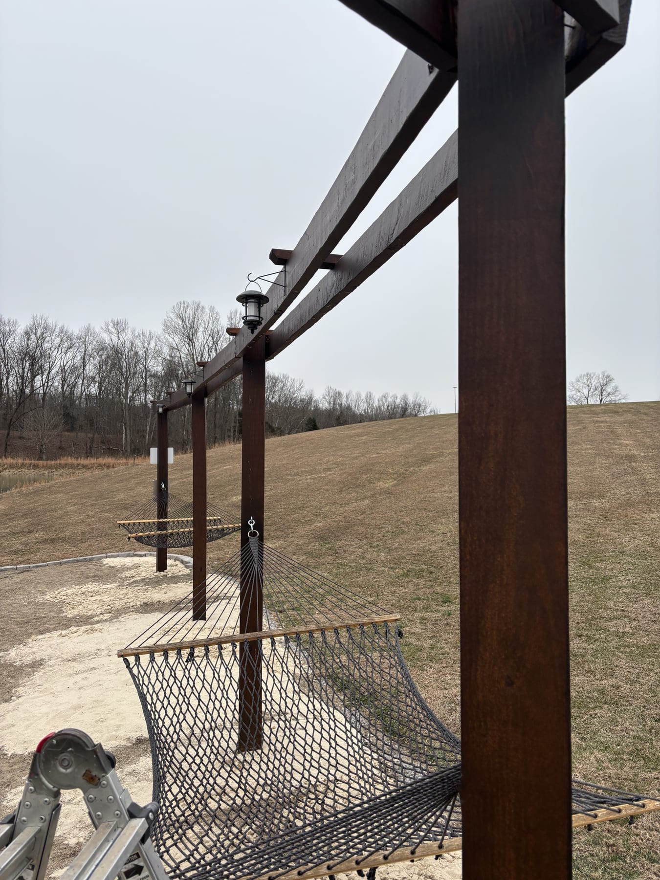 Open deck build · Pulaski County, KY Open pressure-treated deck and rail overlooking the back yard of a Kentucky home.